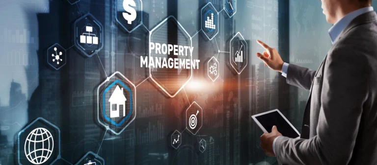 A close-up view of a vibrant blue rectangular sign with the words "PROPERTY MANAGEMENT" in bold, white capital letters. The sign appears to be made of a sturdy material, possibly metal or plastic, and the text is cleanly printed, suggesting a professional and well-maintained property.